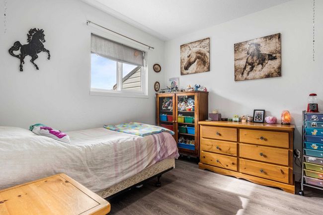 Bedroom with wood finished floors | Image 22