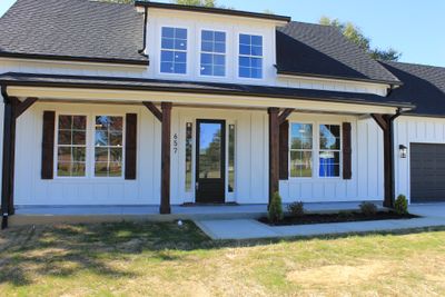 Custom touches everywhere from the oversized gutters to impressive timber supported covered front entryway porch. | Image 2