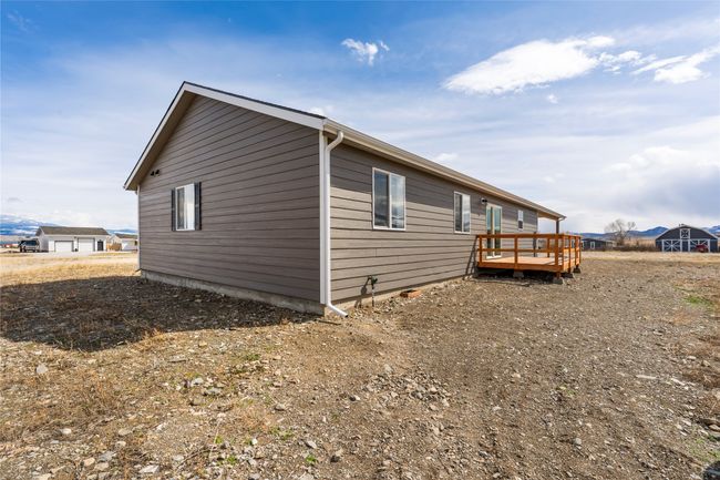 View of side of property with a deck with mountain view | Image 21