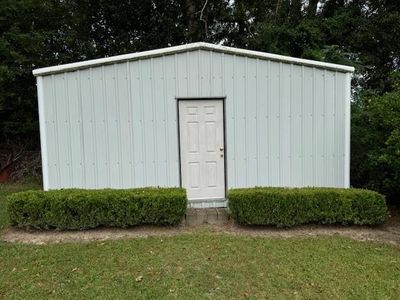 View of front of property with a yard and a garage | Image 2