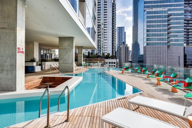 Community pool featuring a city view and fence | Image 18