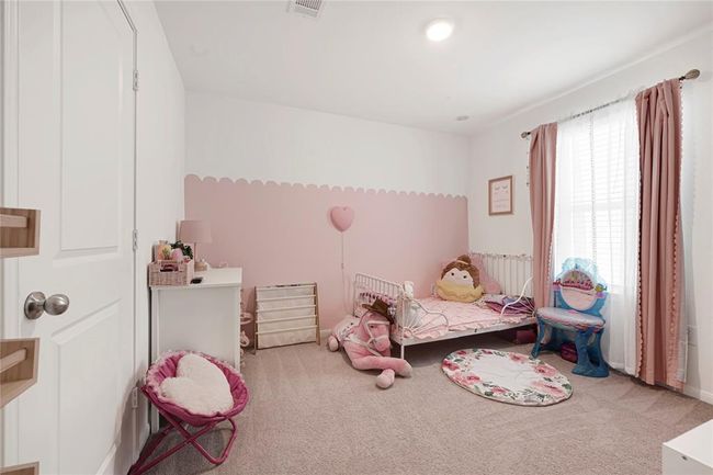 Comfortable secondary bedroom with great natural light and closet space. | Image 25
