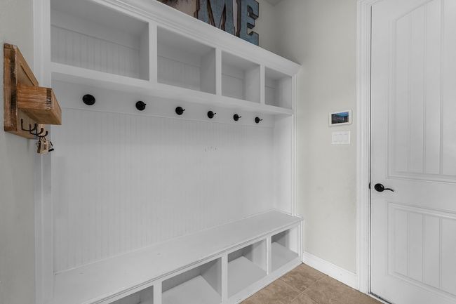 Mudroom with baseboards and light tile patterned flooring | Image 10