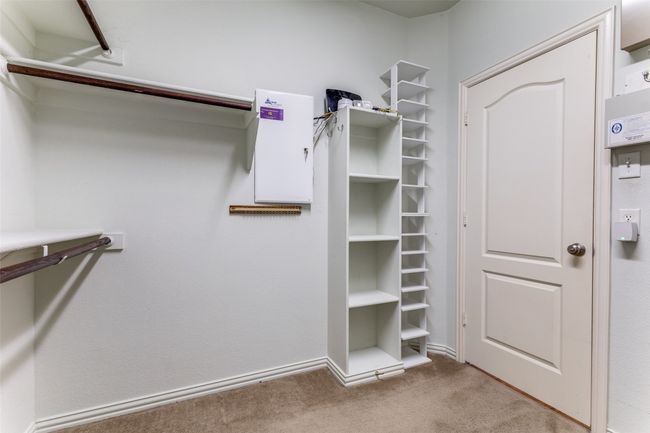 Walk in closet with carpet flooring | Image 13