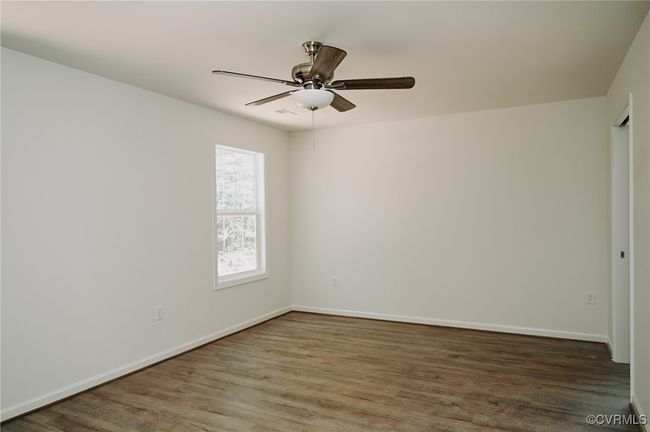 Spare room featuring ceiling fan and dark hardwood / wood-style flooring | Image 14