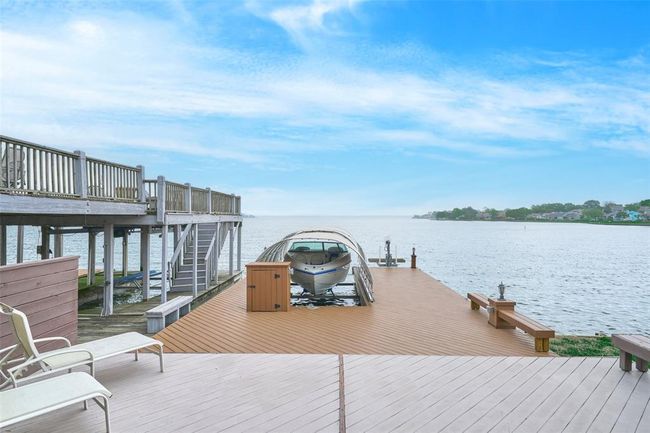 Recently Renovated Dock w/Boat & Jet Ski Lift. | Image 28