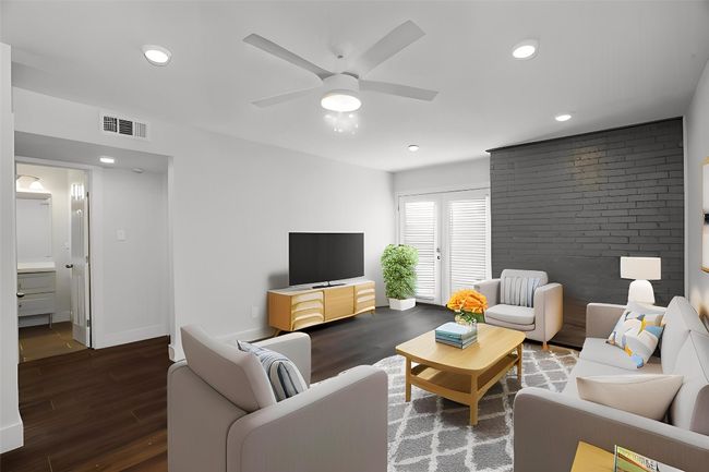 Living area featuring wood finished floors, a ceiling fan, and recessed lighting | Image 6