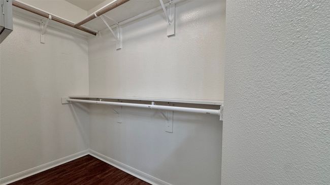 Primary suite offering large walk in closet | Image 11