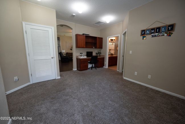 11760 Huckleberry Trl E, House other with 4 bedrooms, 2 bathrooms and null parking in MACCLENNY FL | Image 25
