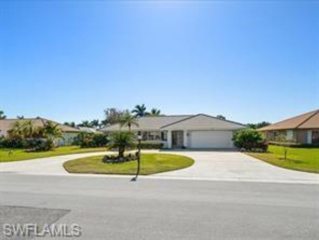 Single story home featuring a garage | Image 1