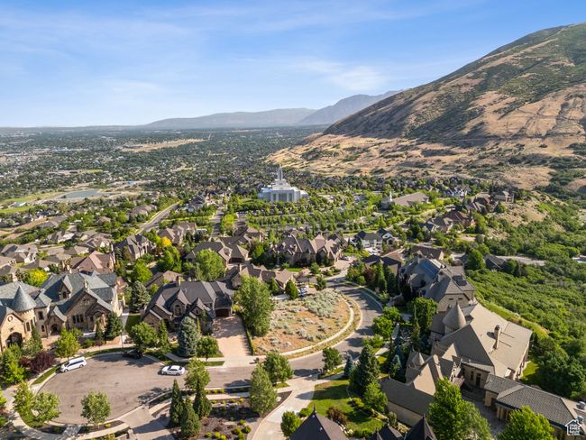 Aerial view of property and surrounding area with a mountain backdrop and nearby suburban area | Image 6