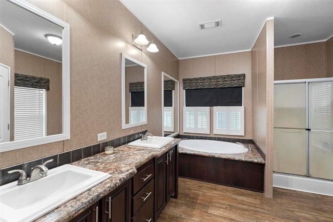 Primary bathroom with dual sinks and separate tub/shower | Image 19