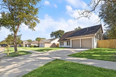 This suburban home is new renovated with a freshly painted exterior | Image 3