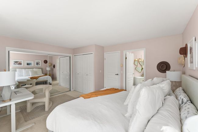 Bedroom with light carpet, two closets, and ensuite bathroom | Image 23