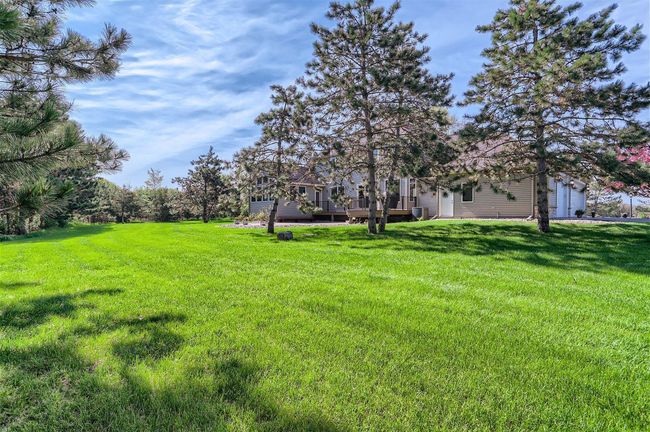Fully irrigated yard is surrounded by trees. Beautiful! | Image 27