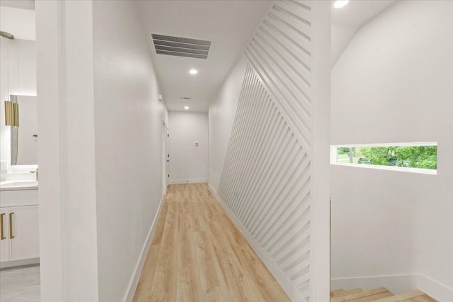 Hall with a sink, baseboards, recessed lighting, and light wood-style floors | Image 10