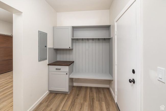 Mudroom featuring hardwood / wood-style flooring and electric panel | Image 34