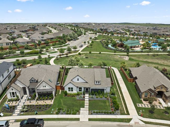 Surrounded by lush greenbelts and open space, the community provides a tranquil escape just minutes from the city. | Image 34