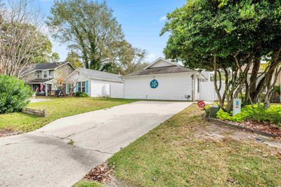 View of front facade with a front yard | Image 2