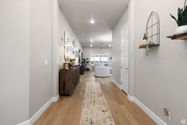 Corridor featuring light wood-style floors and recessed lighting | Image 58