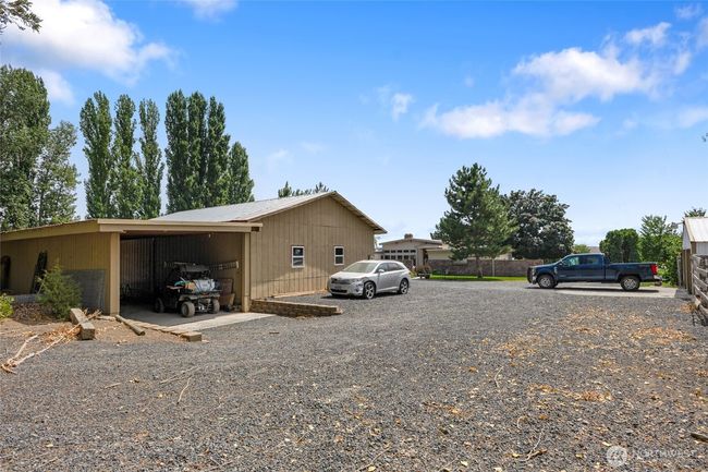 60X60 outbuilding on separate meter with drive though equipment storage. | Image 30