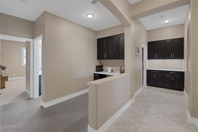 Desk Area, Additional Cabinet storage at end of hallway just outside the laundry room | Image 41