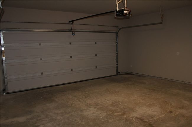Garage featuring a garage door opener | Image 6