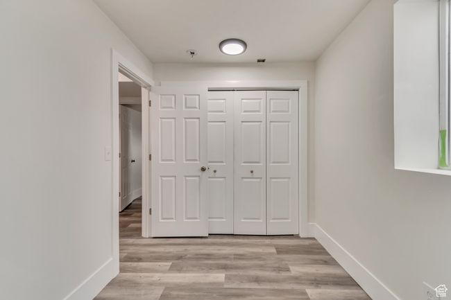 Interior space featuring baseboards and light wood-style floors | Image 20