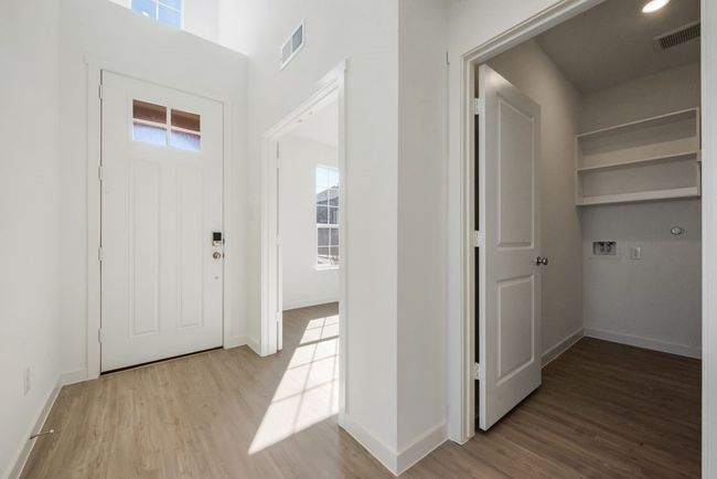 Entryway featuring wood finished floors and healthy amount of natural light | Image 9