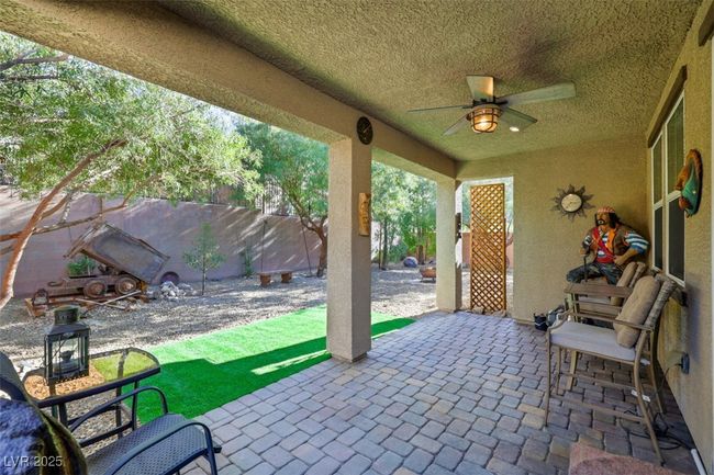 View of patio / terrace with a fenced backyard and ceiling fan | Image 34
