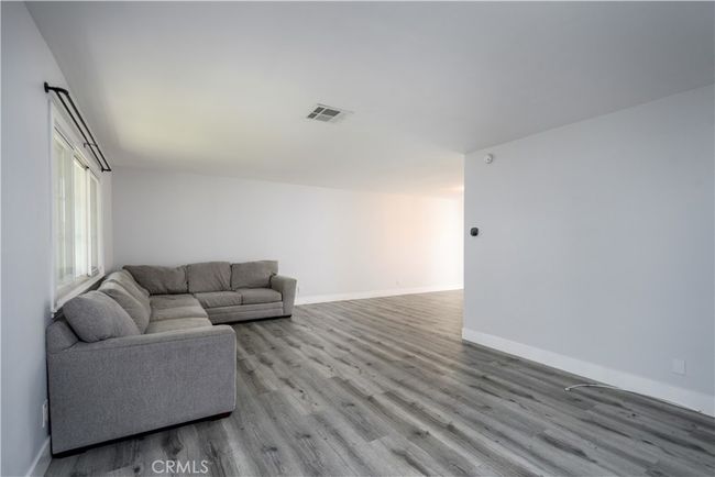 Living room, open to dining room. | Image 4