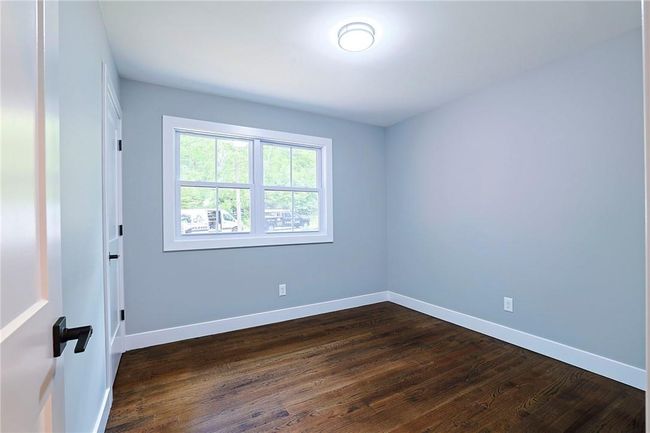 Spare room featuring dark hardwood / wood-style floors | Image 16