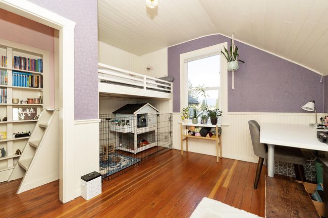 Bedroom with wooden ceiling, lofted ceiling, hardwood / wood-style floors, and wainscoting | Image 14