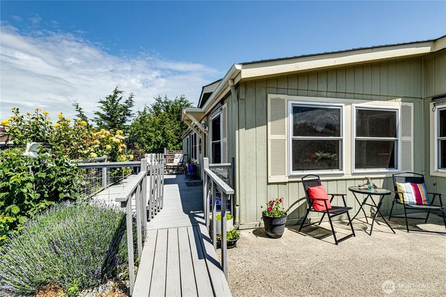 Entertainment sized deck with a mountain view. | Image 4