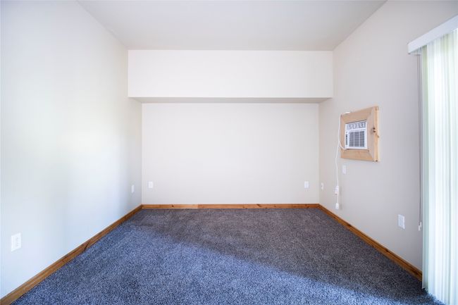 Bonus room with an AC wall unit and carpet | Image 19