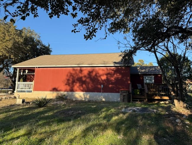 View of side of home with a yard | Image 14