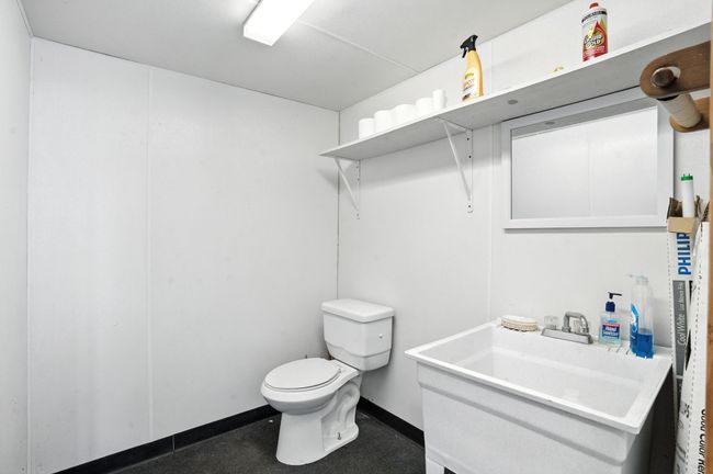 Bathroom featuring toilet and vanity | Image 35