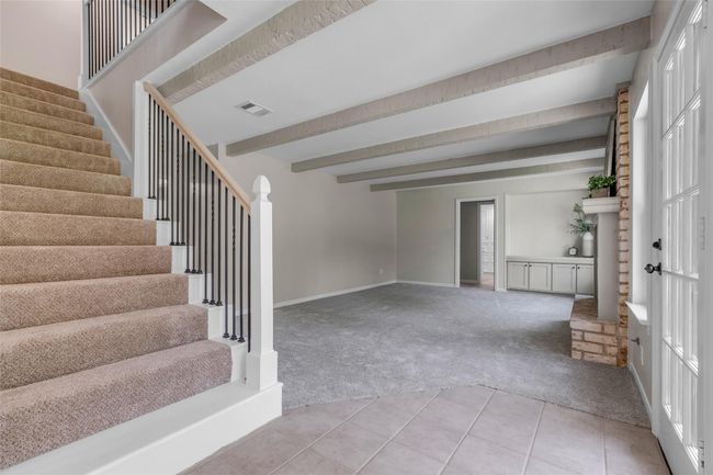 Updated staircase open to large family room. | Image 29