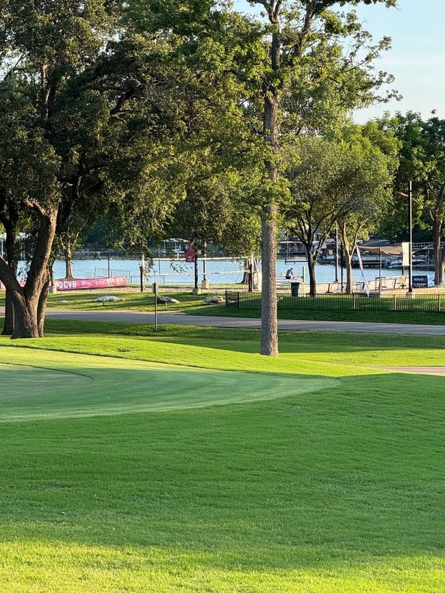 View of property's community featuring view of golf course | Image 10