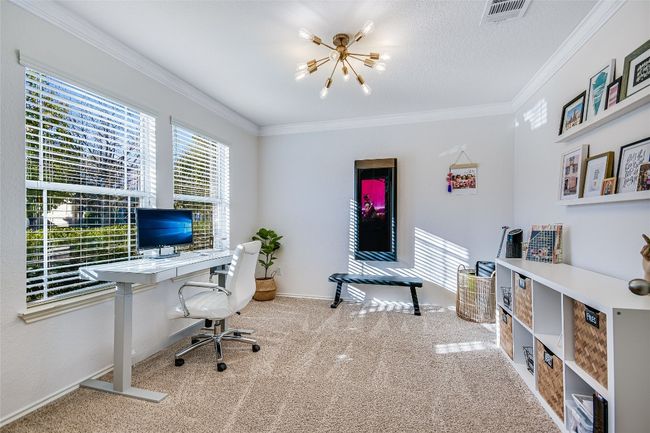 Office featuring a chandelier, carpet flooring, and ornamental molding | Image 11