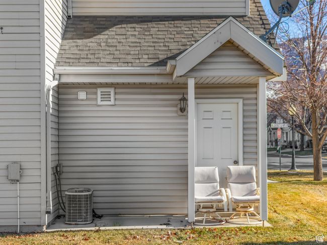 Exterior space featuring cooling unit and a lawn | Image 24