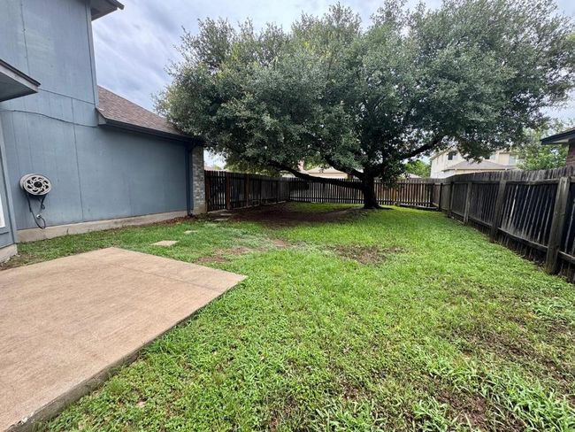 Fenced backyard featuring a patio | Image 24