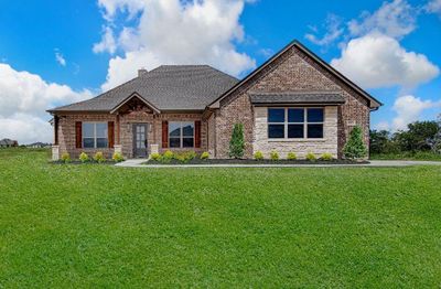 Craftsman-style home featuring a front lawn | Image 1