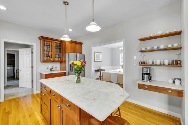 Floating shelves for a clean look. Stainless steel appliances. | Image 9
