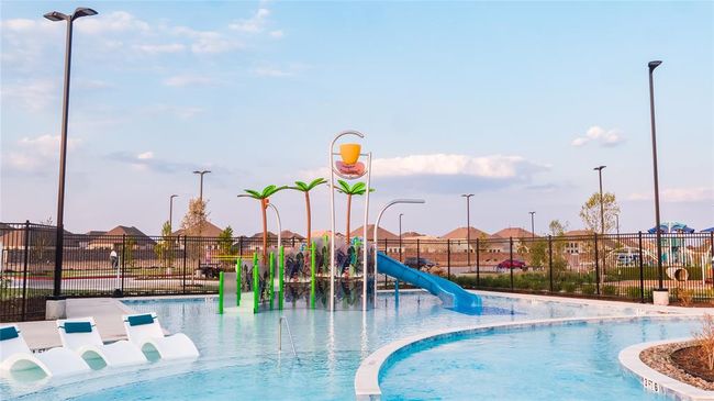 Lounge nearby while the kids play at the water playground. | Image 34