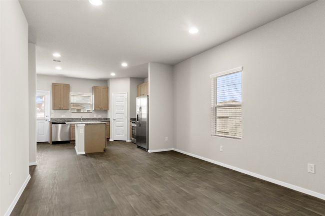 Kitchen with stainless steel appliances, baseboards, a center island, and recessed lighting | Image 8