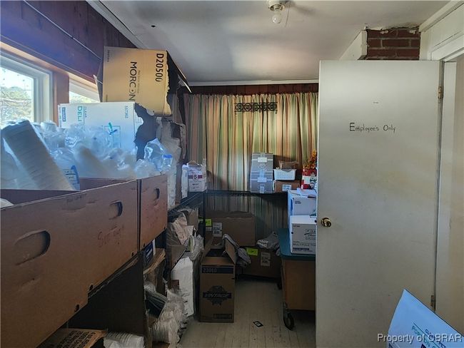 Side room being used for additional storage. Could be used as office space with closed door for privacy. | Image 23
