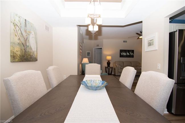 Spacious dining room opens to both the kitchen and living room. | Image 16