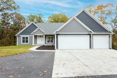 View of front of house with a front lawn and a garage | Image 3