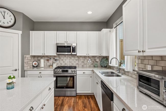 Kitchen is spacious and features a walk-in pantry | Image 15